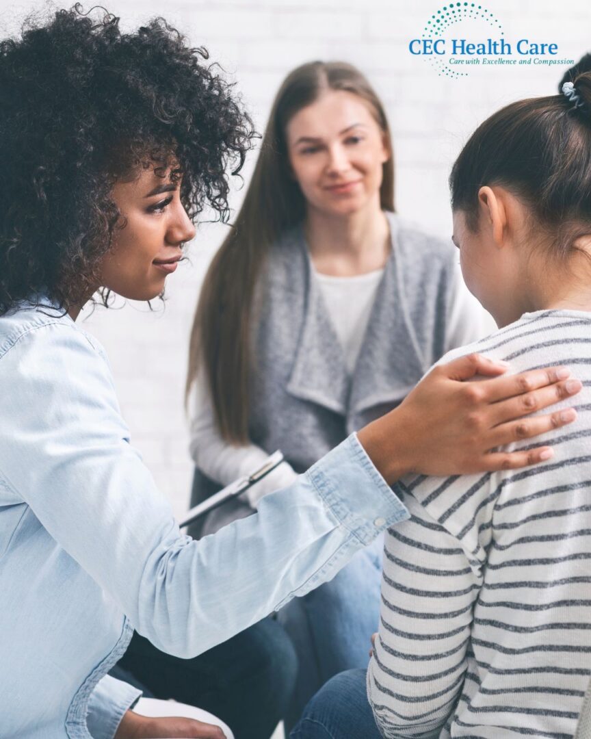 Woman comforting another in group therapy